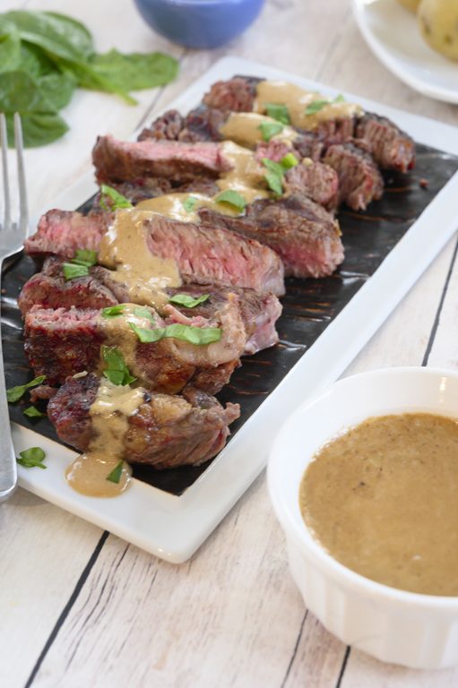 Simple Grilled Ribeye Steak with Onion Blue Cheese Sauce recipe is absolutely divine and the perfect choice for a summer cookout! No need to go to your local steakhouse when you can make it easily right at home!
