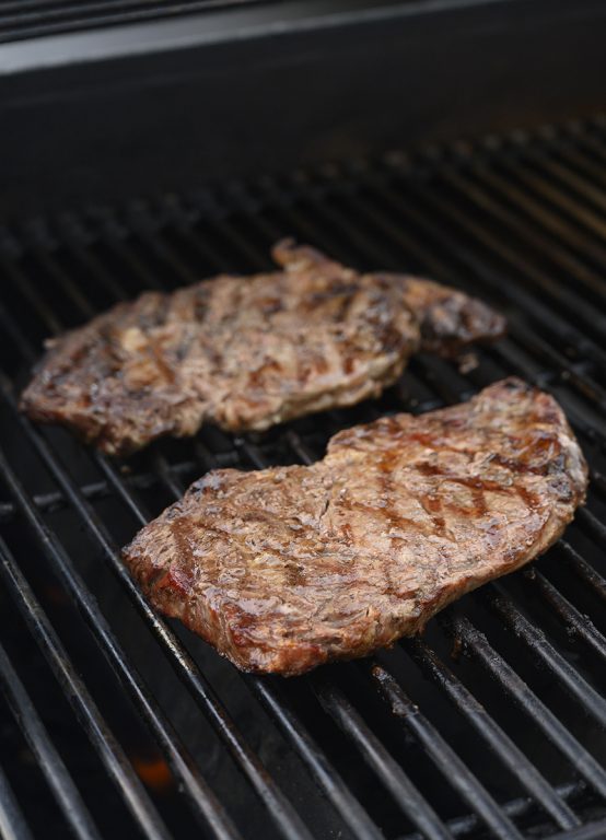 Grilling the ribeyes or Delmonico steaks on the Weber grill.
