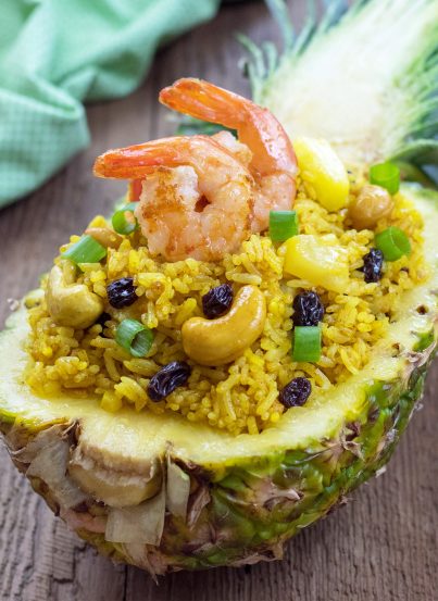Skip the takeout this week and make this Pineapple Shrimp Fried Rice. It is sweet and savory and an easy Asian recipe to make at home!