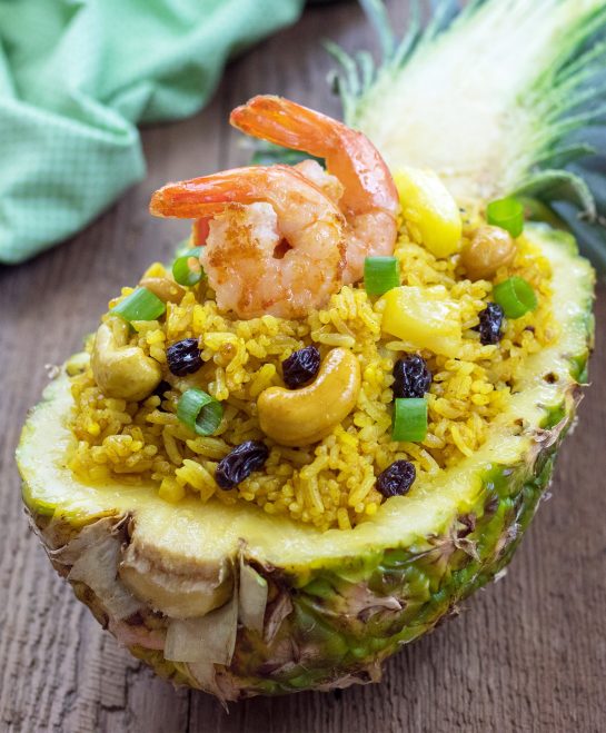 Skip the takeout this week and make this Pineapple Shrimp Fried Rice. It is sweet and savory and an easy Asian recipe to make at home!