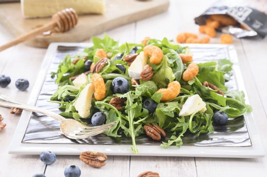 This is an easy healthy salad recipe with fruit: Blueberry-Brie Pecan Salad with Protein Puff Croutons. The protein puffs and candied pecans add so much crunch and flavor!