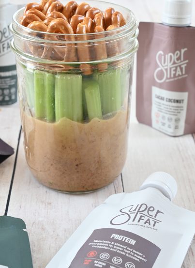 Mason Jar Pretzel, Celery, Almond Butter Snack with SuperFat nut butter is the perfect healthy on-the-go snack loaded with protein to give you a quick boost of energy during the day!
