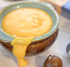 Cheddar Hard Cider Fondue recipe perfect for party appetizers or intimate dinners. Choose your favorite selection of dippers and see how delicious this is!