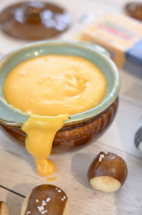 Cheddar Hard Cider Fondue recipe perfect for party appetizers or intimate dinners. Choose your favorite selection of dippers and see how delicious this is!