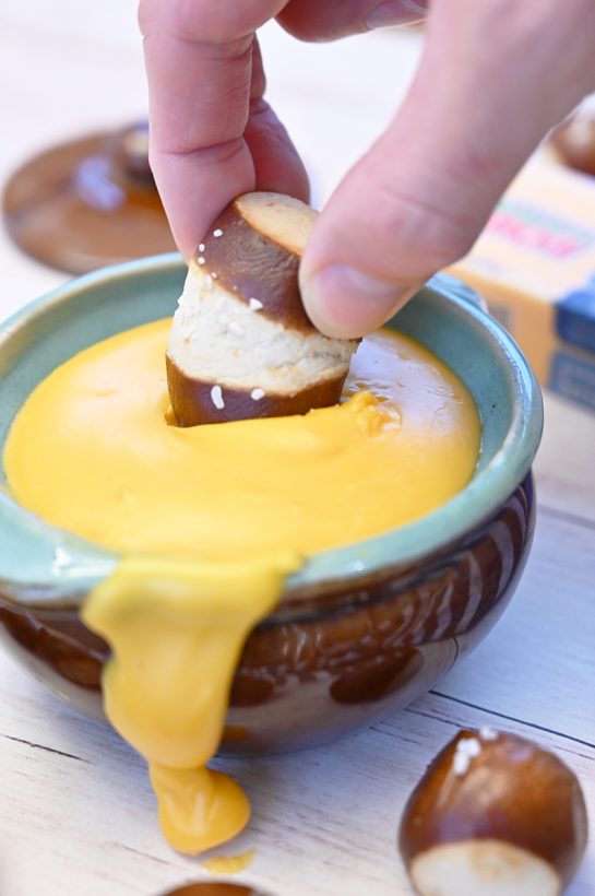 Sharp Cheddar Hard Cider Fondue recipe perfect for game day, party appetizers or intimate dinners. Choose your favorite selection of dippers and see how delicious this is!