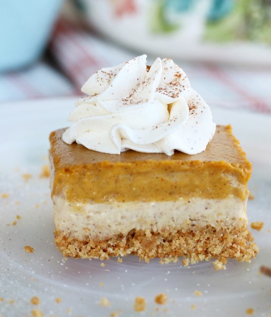 This amazing pumpkin cheesecake bars recipe has buttery graham cracker crust, a cream cheese layer and a pumpkin cream cheese layer! A great fall dessert idea!