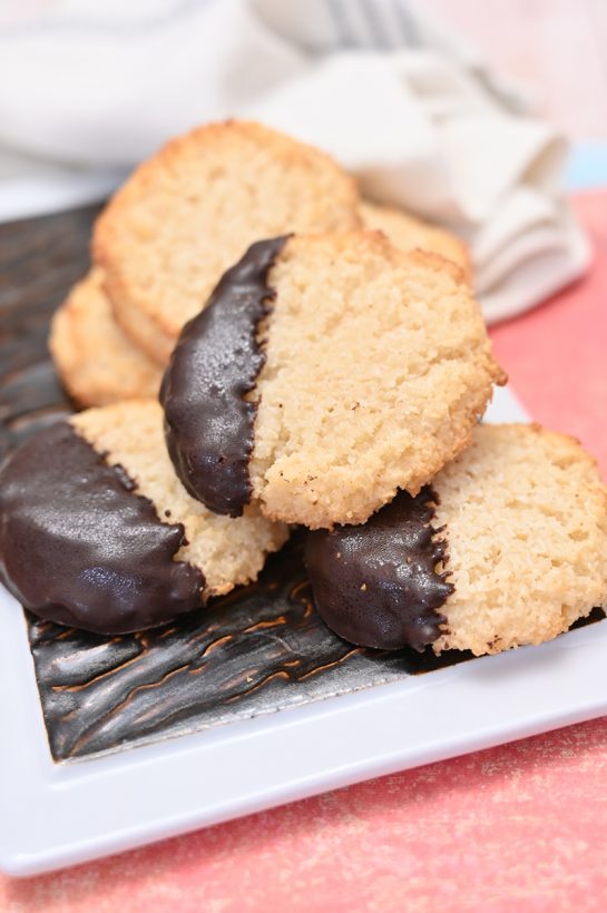 Italian Chocolate Dipped Coconut Macaroons have a sweet and chewy texture, dipped in sweet melted chocolate for the ultimate holiday dessert experience. This recipe is so easy to make!