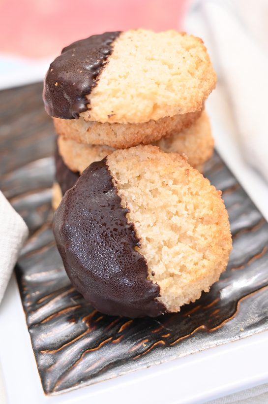 Chocolate Dipped Coconut Macaroons have a sweet and chewy texture, dipped in sweet melted chocolate for the ultimate holiday dessert experience. This recipe is so easy to make!