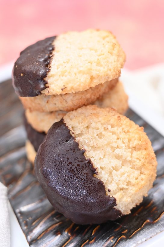 Italian Chocolate Dipped Coconut Macaroons have a sweet and chewy texture, dipped in sweet melted chocolate for the ultimate holiday dessert experience. This recipe is so simple for Christmas or any holiday!