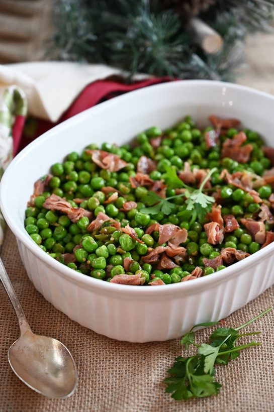Easy Peas with Prosciutto recipe is the best 20 minute side dish for a weeknight meal or a holiday feast! Peas are richly flavored by salty prosciutto as well as the pork's rendered fat. Delicious!