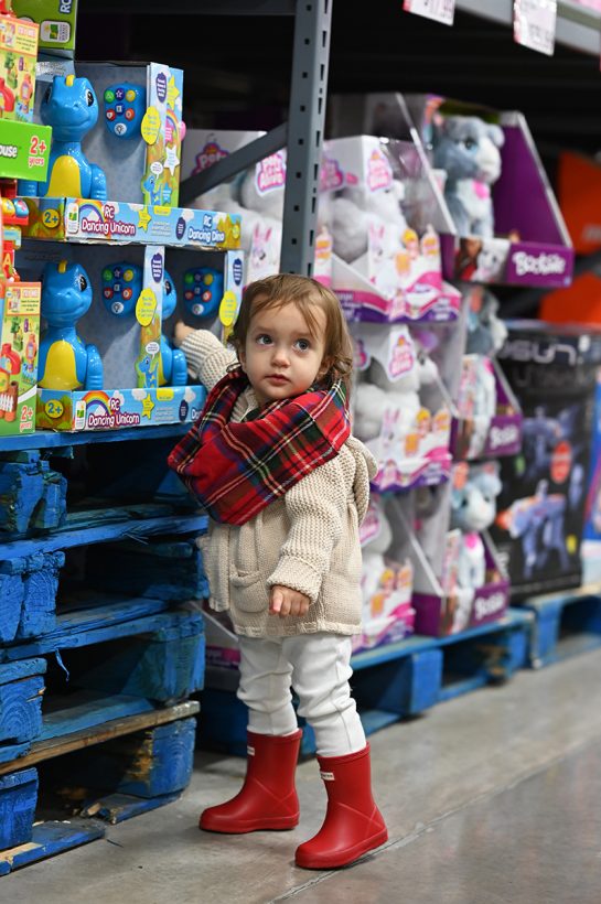 Toddler girl shopping for toys at BJ's Wholesale Club