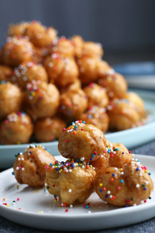 A close up shot of a serving of the struffoli on a plate ready to eat.
