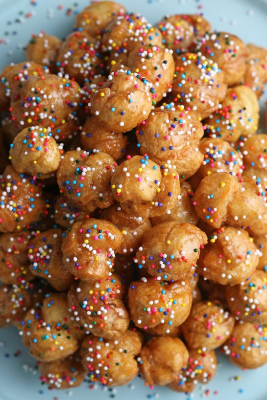 A top down shot of the finished struffoli recipe, perfectly brown and ready to be enjoyed.