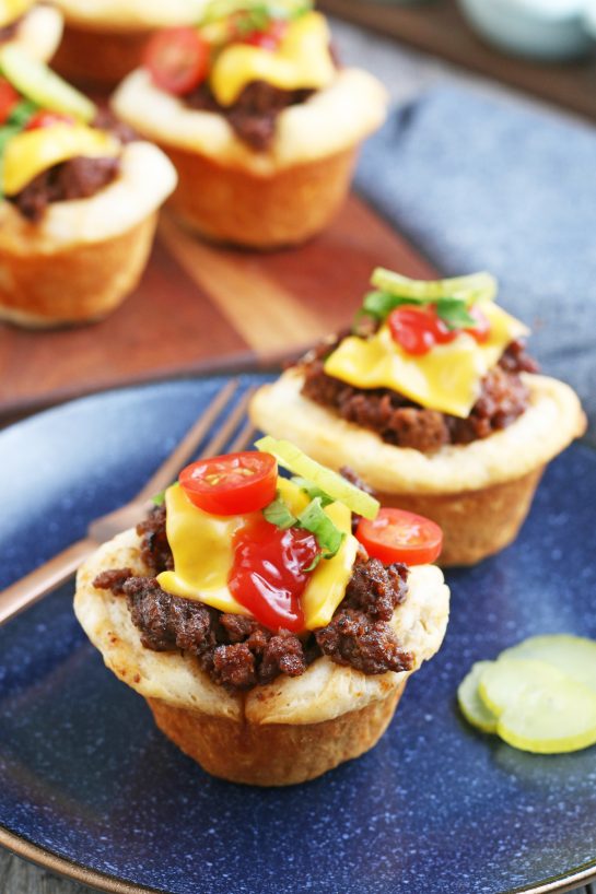 Here we see the completed cheeseburger cups on a plate ready to be enjoyed.