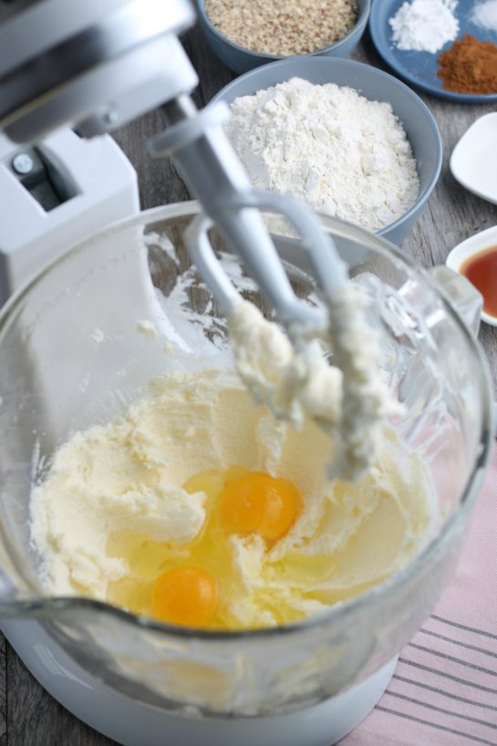 Here we see into the stand mixer as the eggs are added to our linzer tart cookies.