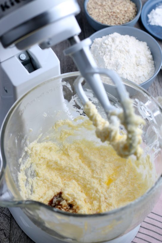 The wet ingredients are blended together in our stand mixer for the batter for our recipe for linzer cookies.