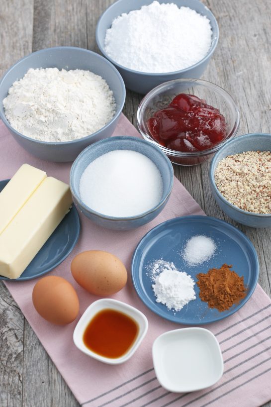 Here we see all of the ingredients needed to make linzer cookies ready before we begin baking.