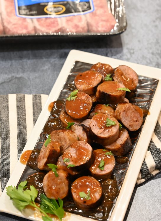 Easy Grilled Beer Brat Bites appetizer recipe for any party simmered in a malty beer sauce with soft, nearly caramelized flavor that tastes delicious!