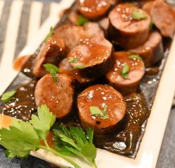 Grilled Beer Brat Bites appetizer recipe for any party simmered in a malty beer sauce with soft, nearly caramelized flavor that tastes delicious!