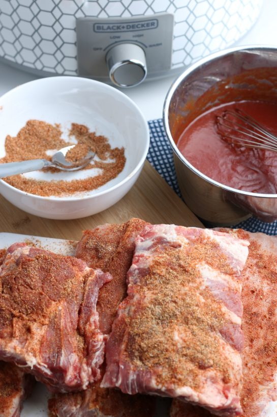 Applying the dry rub to the ribs generously helps keep them spicy and delicious with every bite.