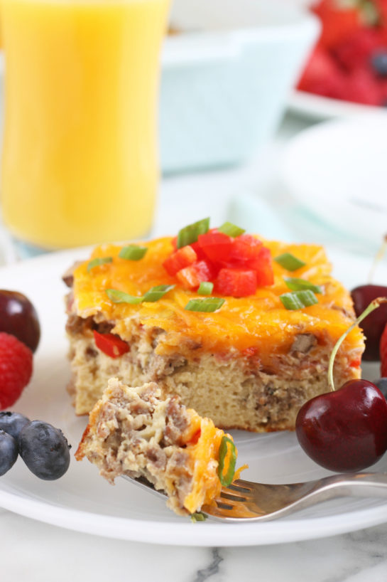 One serving of the breakfast egg casserole on a plate with a bite on a fork ready for eating!