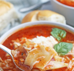 A spoonful of the delicious lasagna soup ready to be enjoyed.