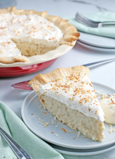 This photo shows us a slice of the best coconut cream pie recipe all finished and ready to eat.