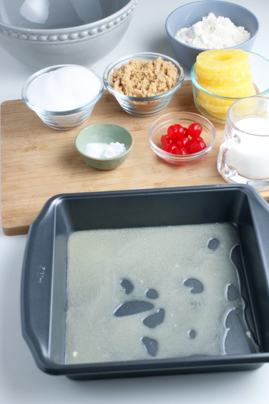 Here we see the first step in making the upside down cake, preparing the baking pan!