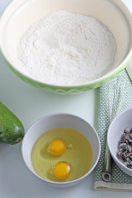 Adding the eggs to make the zucchini muffins recipe