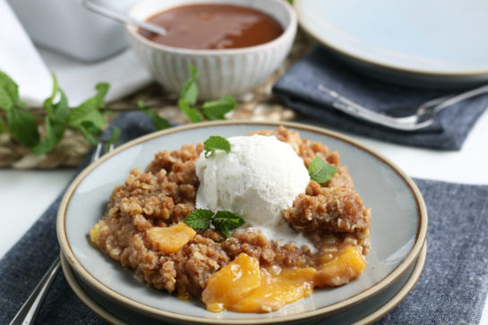 Simple Fresh Peach Crisp recipe: deliciously sweet and juicy peach layer topped with the most irresistible crisp topping in the world. This is the perfect late summer and fall dessert!