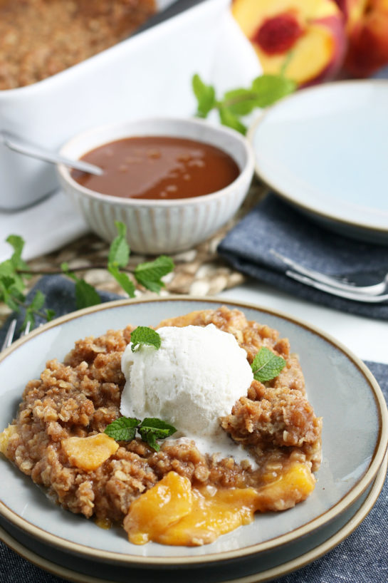 The Best Fresh Peach Crisp recipe: deliciously sweet and juicy peach layer topped with the most irresistible crisp topping in the world. This is the perfect summer and fall dessert and is super easy to make! 