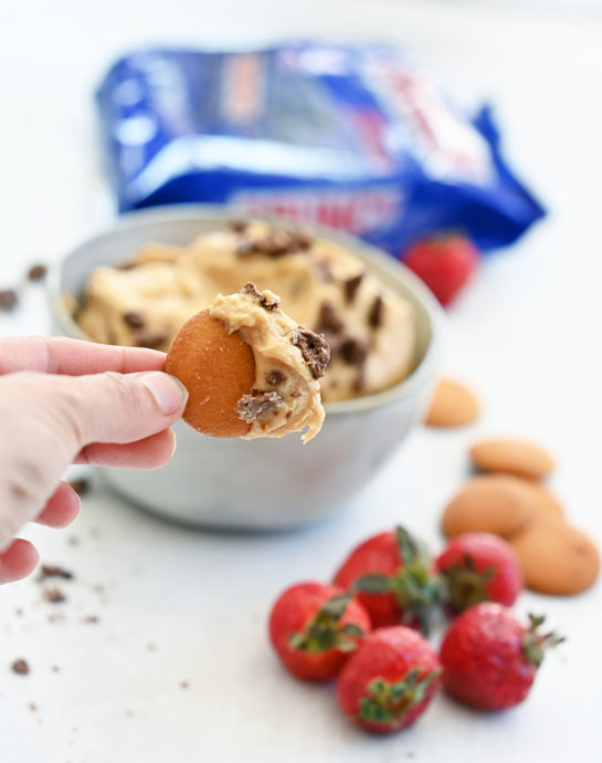 Easy Peanut Butter Crunch® Bar Dip is a sweet dunkable dessert dip recipe that's perfect for parties and made in less than 10 minutes. Slice up an apple and dig in!