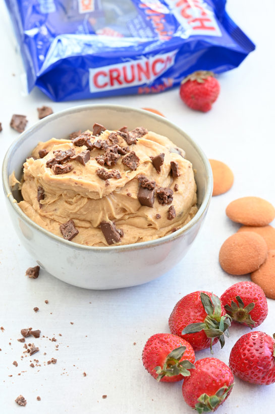 Indulgent Peanut Butter Crunch® Bar Dip is a sweet dunk-worthy dessert dip recipe that's perfect for parties and made in less than 10 minutes. Slice up an apple and dig in!
