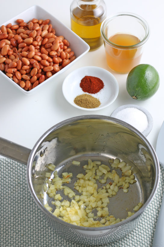 Cooking the onions for the homemade refried beans