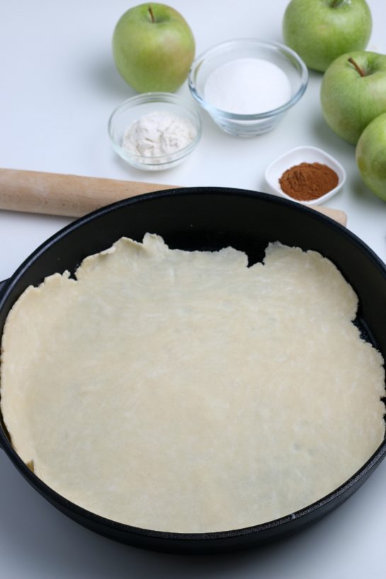 Placing the pie crust dough in the pan for the apple crostata recipe