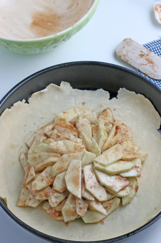 Adding in the apples and dry ingredients for the apple crostata recipe