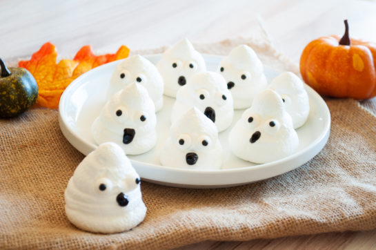 Cute Halloween Boo Meringues are an incredibly fun and easy Halloween recipe for kids for a holiday party! The whole family will love them!