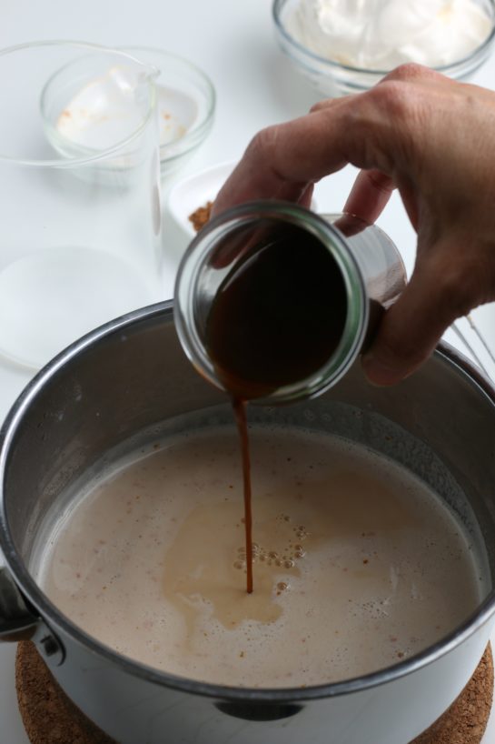 Adding the brewed coffee or espresso to the pot to make my Homemade Pumpkin Spice Latte recipe