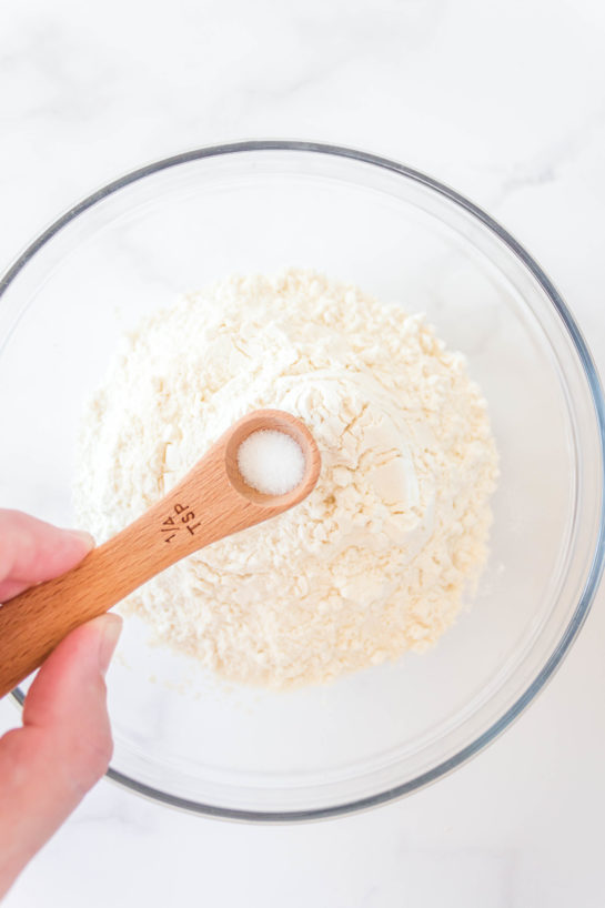 Adding the dry ingredients needed for Edible Cookie Dough Bombs recipe