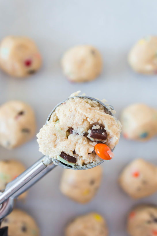 Scooping out the dough for Edible Cookie Dough Bombs recipe