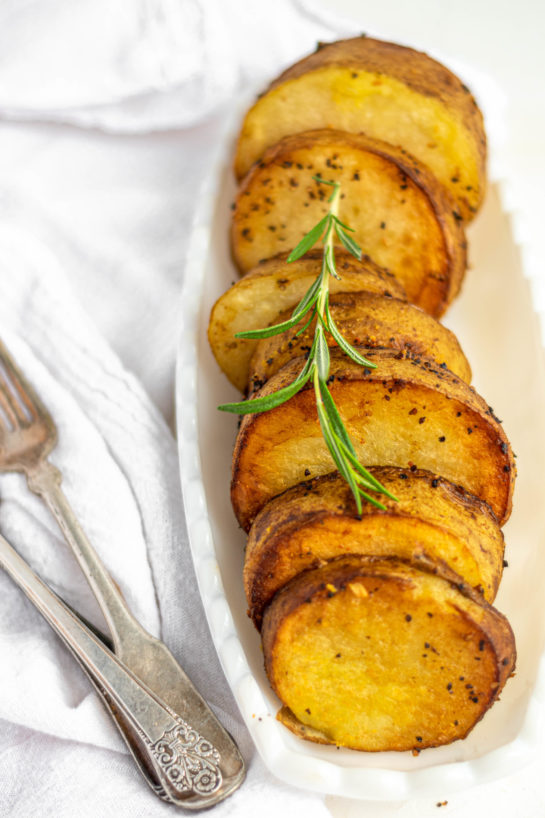 Easy Melting Potatoes recipe might just become your new go-to side dish for Thanksgiving and Christmas! Baking the Russet potatoes in high heat caramelizes the outsides, and finishing them in chicken broth makes the insides super creamy!