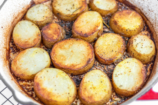 The pan coming out of the oven for the melting potatoes recipe