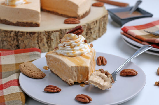 Finished shot of the No Bake Pumpkin Cheesecake with extra spiced flavor and gingersnap crust. It is a fool proof recipe because it turns out amazing every time! This is the perfect Thanksgiving or Christmas dessert!