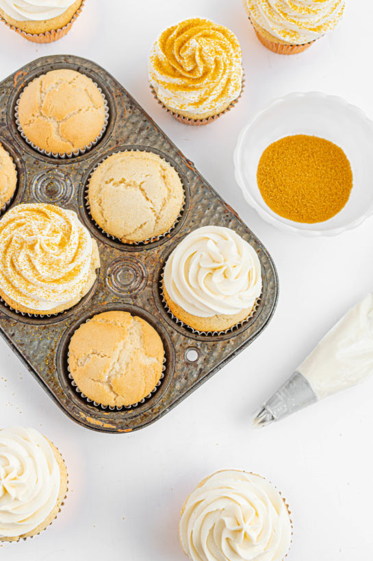 Frosting the Champagne Cupcakes with the buttercream frosting