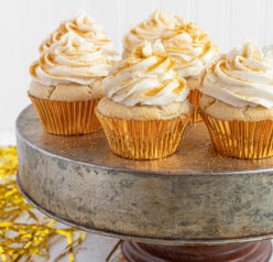 Celebration Champagne Cupcakes recipe is perfect for birthdays, Mother's Day brunch or a New Year’s Eve dessert! They are jazzed up with gold sprinkles to add some glam!