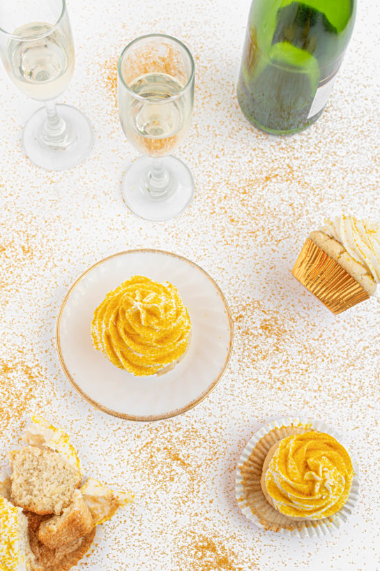 Overhead shot of the finished Champagne Cupcakes recipe with the gold sprinkles