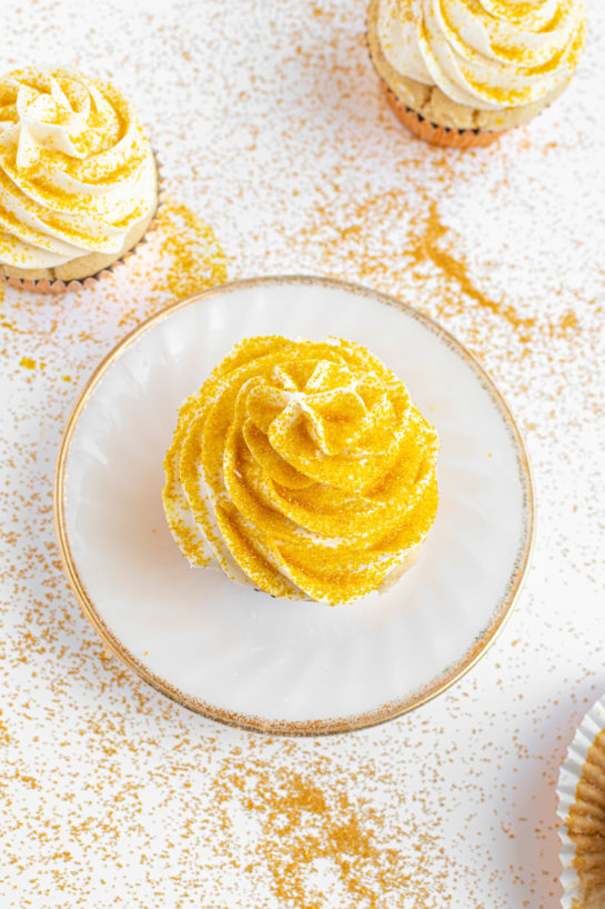 Overhead shot of the finished Champagne Cupcakes recipe with the gold sprinkles