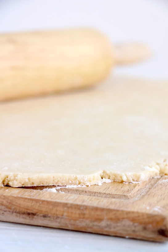 Rolling out the dough to make the Christmas Sugar Cookie Bites recipe