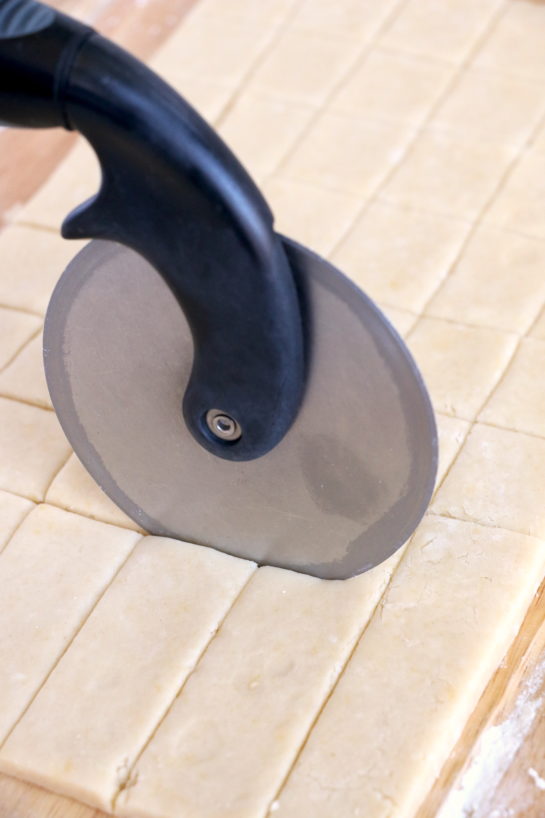 Slicing the dough to make the Christmas Sugar Cookie Bites recipe