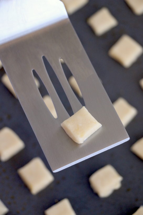 Placing the dough on the baking sheet to make the Christmas Sugar Cookie Bites recipe